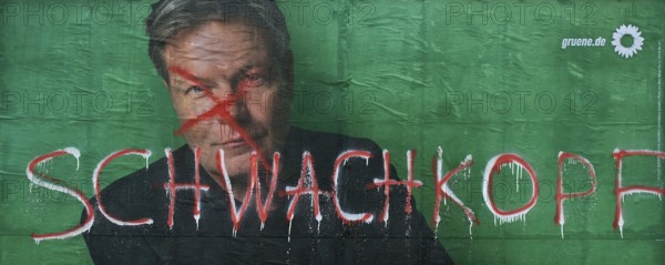 Denigration of a large poster for the 2025 federal election by the Greens with Robert Habeck,