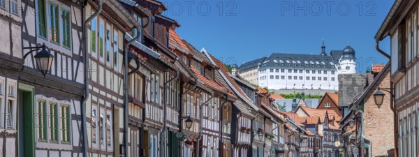 Street with half-timbered houses in the old town, the castle in the background, Stolberg im Harz,