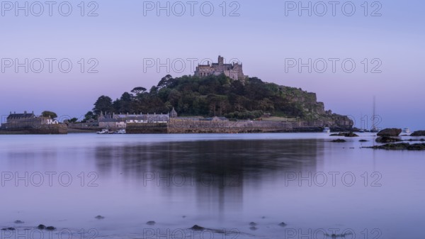 View of St Michaels Mount from Marazion Beach. In the evening after sunset, blue hour. St Michael's