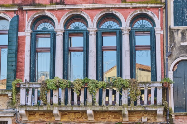 Windows of an old house on 'Campo santa margherita' town square in Venice on a sunny day in winter,