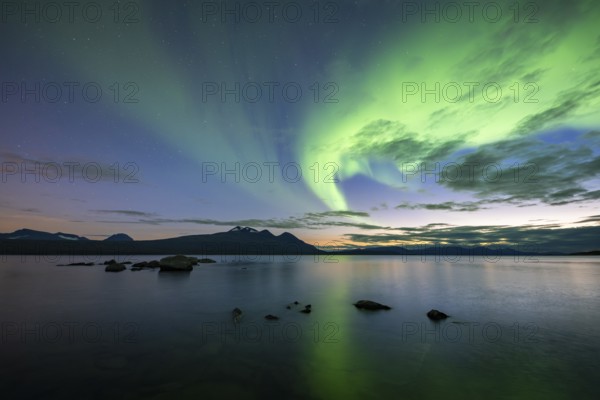 Northern Lights over Lake Akkajaure and Akka mountain range, Stora Sjöfallet National Park,