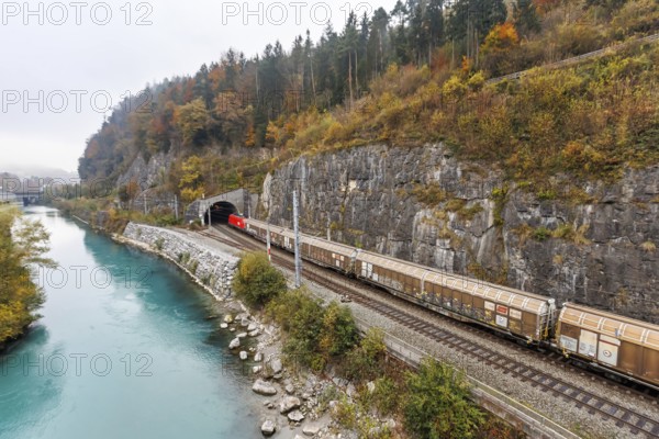 Goods train of the Austrian Federal Railways ÖBB Eisenbahn on the Arlbergbahn in autumn in