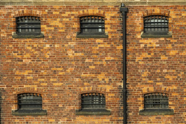 Cell windows with bars, exterior of Victorian jail museum, Lincoln Castle, city of Lincoln,