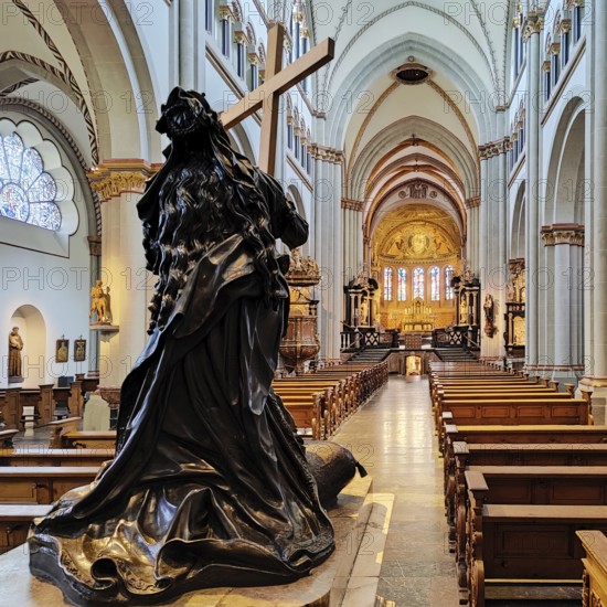 Interior view of Bonn Minster, bronze statue of St Helena with nave and view to the east apse,