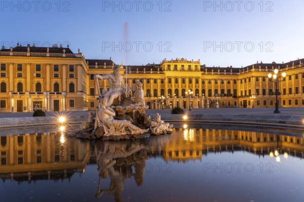 Fountain in the courtyard of honour at Schönbrunn Palace at dusk, UNESCO World Heritage Site in