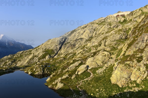 Sloping rocky area in the Aiguilles Rouges nature reserve between the mountain lake Lacs des