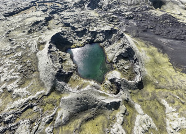 Lake in Tjarnargigur crater, moss-covered Laki crater or Lakagígar, series of craters, aerial view,