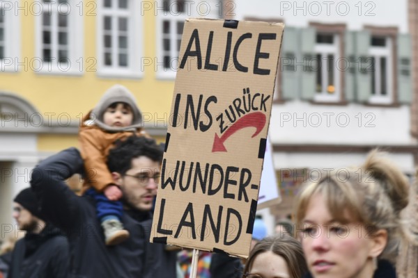 Heidelberg, Germany - February 12th 2025: Person holding up sign with text 'Fascism is not an
