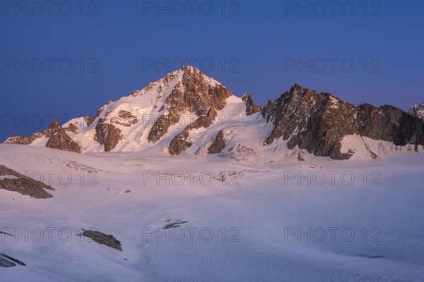 High alpine mountain landscape at sunset, Glacier du Tour, glacier and mountain peak, summit of the