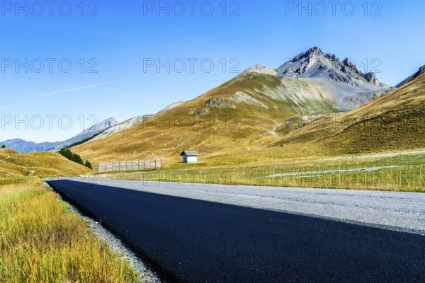 View of road and mountains at border pass Col de Larche (Colle della Maddelena), Provinz Cuneo,