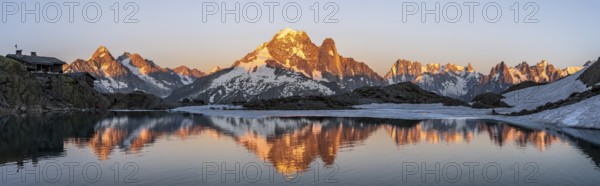 Evening mood, mountain landscape at sunset, alpenglow, water reflection in Lac Blanc with mountain