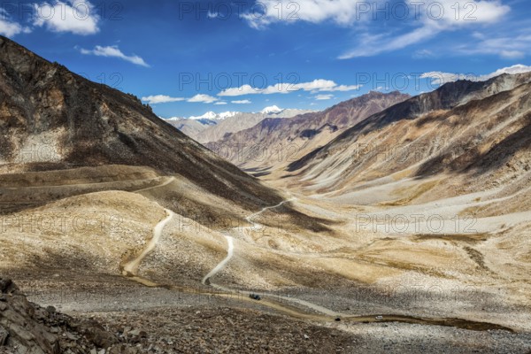 Himalayan valley landscape with road near Kunzum La pass, allegedly the highest motorable pass in