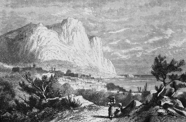 Mediterranean island of Capri in the Gulf of Naples, landscape with limestone cliffs, town, sandy