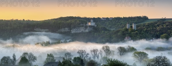Landscape with the castle ruins Rudelsburg and Saaleck and manor Kreipitzsch, sunrise, morning fog