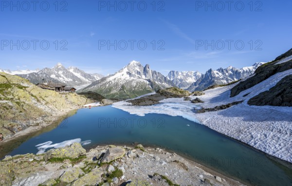 Mountain landscape with mountain lake Lac Blanc, mountain peaks, Aiguille Verte, Grandes Jorasses,