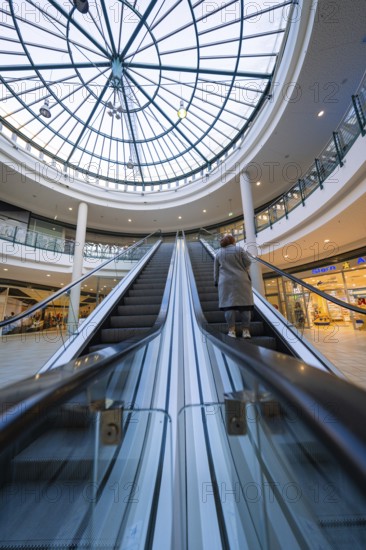 Escalator in a shopping centre leading to a large glass roof, Sterncenter Sindelfingen, Böblingen