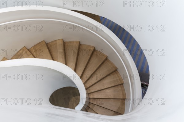 Modern spiral staircase in Vitra Haus, wooden steps, architects Herzog & de Meuron, Vitra Campus,