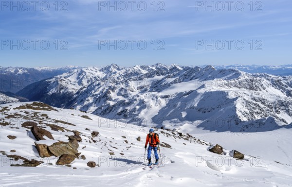 Ski tourers on a high tour on the Fürkeleferner glacier, view of the mountain panorama,