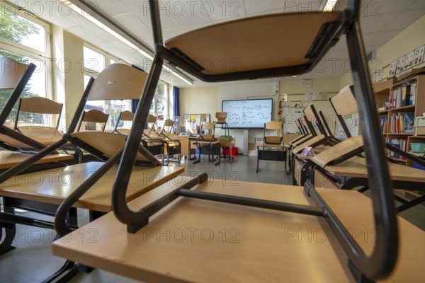 Classroom of a fourth grade, after school, the building is older but in good condition, modern