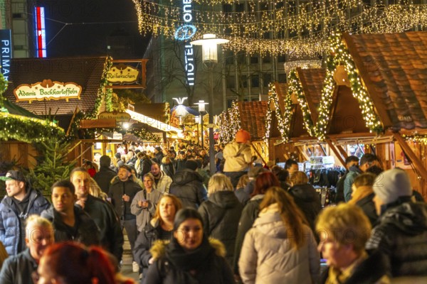 Pre-Christmas season, people, shoppers, visitors to the Christmas market in the city centre of