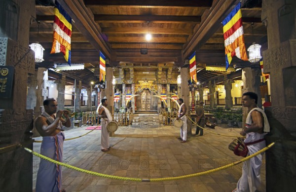 Drummers and flute players at a shrine in the Buddhist Temple of the Tooth or Sri Dalada Maligawa,