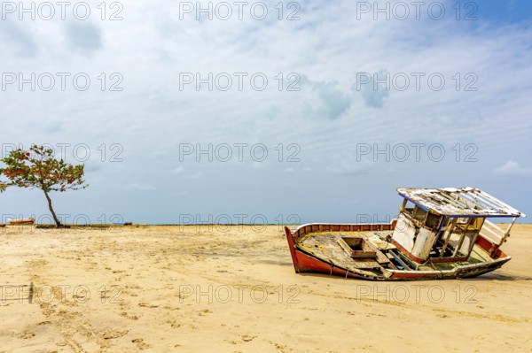 Deteriorated fishing trawler stranded on the beach sand in Olinda, Pernambuco, Olinda, Pernambuco,