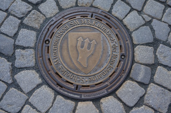 Municipal manhole cover with symbol of the navy, Kulmbach, Upper Franconia, Bavaria, Germany,