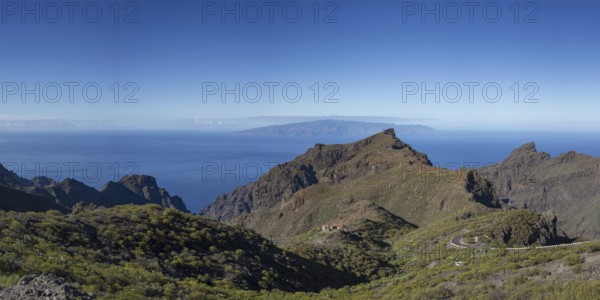 Volcanic rock formation and the Masca Gorge, Barranco de Masca, Teno Mountains, Tenerife, behind La