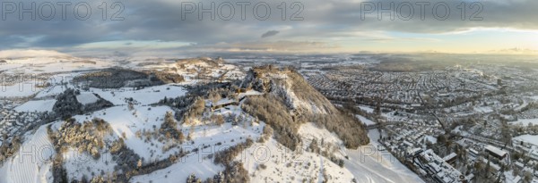 Aerial view, panorama of the snow-covered Hegau volcano Hohentwiel with Germany's largest castle