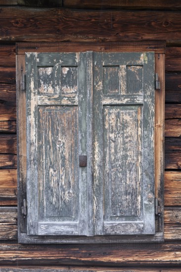 Detailed view of wooden shutters of a hut on an alpine meadow at the foot of the Peitlerkofel,