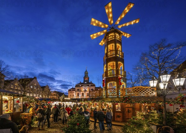 Christmas market with large Christmas pyramid on the market square, behind the historic town hall,