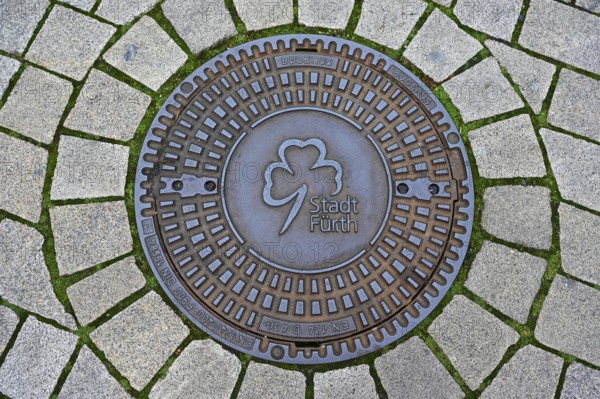 Manhole cover with coat of arms of the city of Fürth-Bavaria, Middle Franconia, Bavaria, Germany,