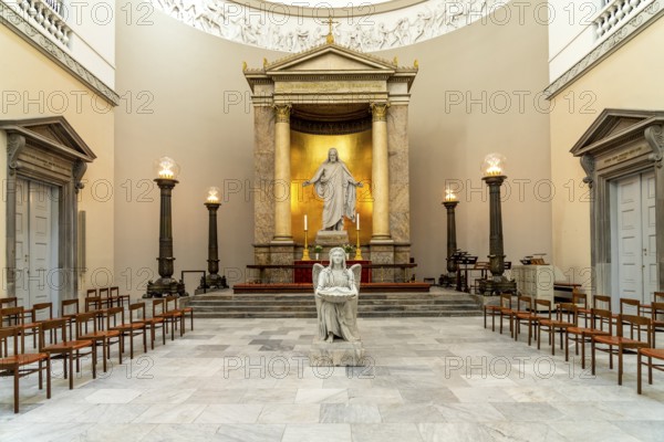 Christ statue and baptismal font by Bertel Thorvaldsen in the Church of Our Lady in front of Frue