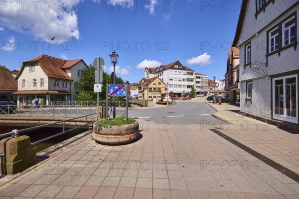 Car and pedestrian bridge, general development, lantern, pavement made of paving slabs, blue sky