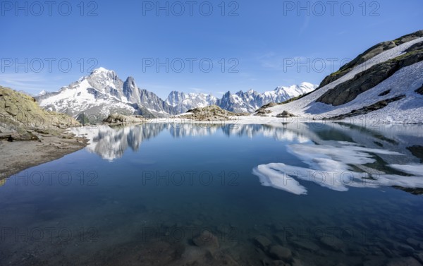 Mountain landscape with mountain lake, water reflection in Lac Blanc, mountain peak, Aiguille