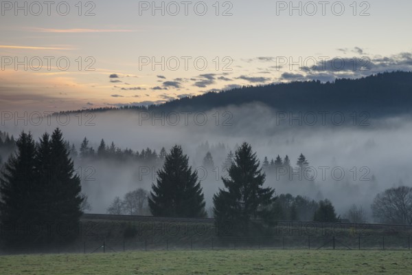 Autumnal evening mood with fog in the valley and in the forests of the Bavarian Forest National
