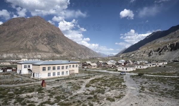 Abandoned ruined buildings in a mountain landscape, ghost town, Engilchek, Tian Shan, Kyrgyzstan,