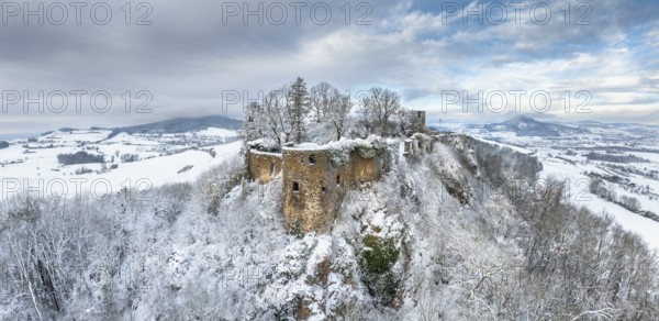 Aerial view, panorama of the snow-covered Hegau volcano Mägdeberg with remains of a castle wall on