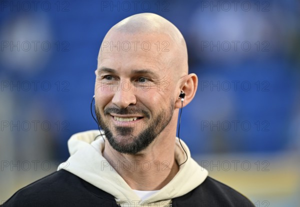 Coach Christian Ilzer TSG 1899 Hoffenheim Portrait in interview Microphone Micro Logo smiles