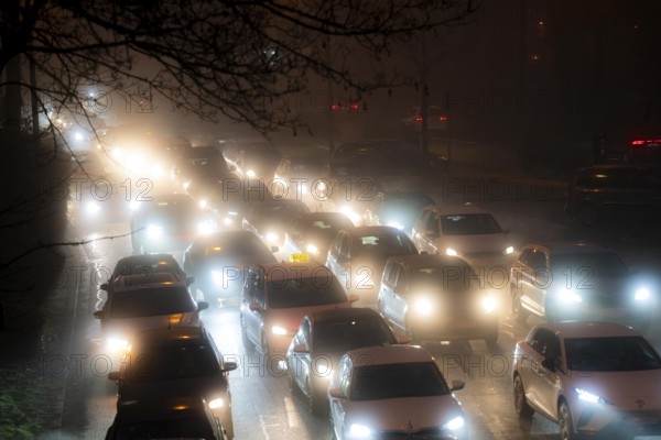 Dense fog, with visibility sometimes less than 100 metres, city centre traffic during rush hour at