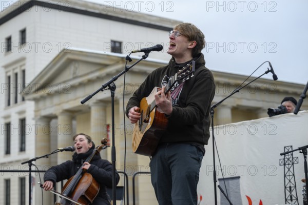 Marlo Grosshardt plays at the Fridays for Future climate strike at the Brandenburg Tor in Berlin.