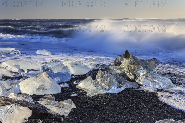 Ice floes on the beach, waves, sea, sunny, morning light, winter, Diamond Beach,