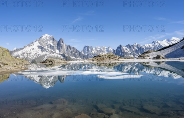 Mountain landscape with mountain lake, water reflection in Lac Blanc, mountain peak, Aiguille