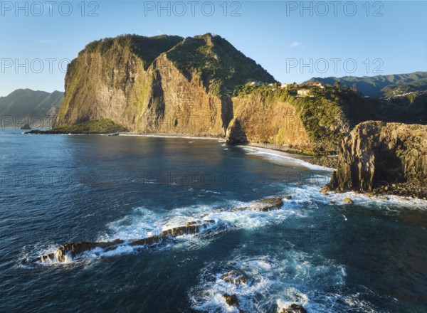 Aerial view of Madeira cliffs coastline landscape on sunrise, Guindaste viewpoint, Madeira island,