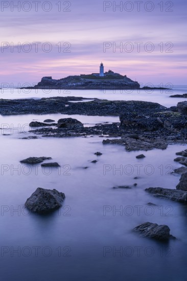 Godrevy Lighthouse, the lighthouse of Godrevy on Godrevy Island. In the evening at sunset. Long