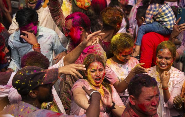 Revellers smear with Gulal or coloured powder and dance to play Holi, the Hindu spring festival of