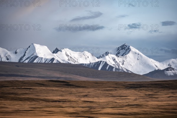 Glaciated and snow-capped mountains, dramatic landscape, high plateau, autumnal mountain landscape