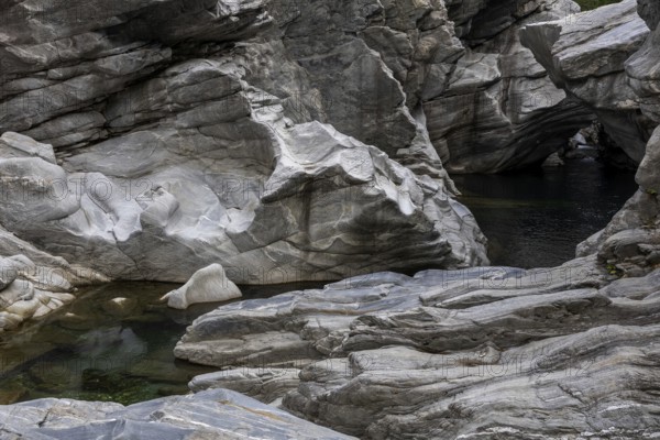 Rocks, granite rock formations in the Maggia River near Ponte Brolla, in the Maggia Valley, Valle