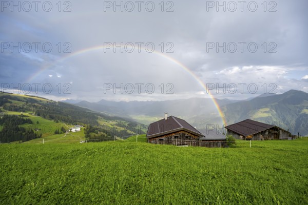 Alpine huts, view over the Brixen Valley with rainbow, Hochbrixen, Brixen im Thale, Kitzbühel Alps,