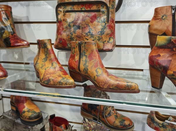 Photo of colourful ankle boots and handbags with floral patterns, La Boca district, Buenos Aires,